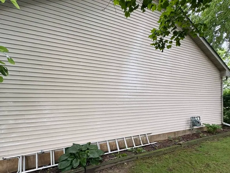 House siding clean and cream coloured after washing
