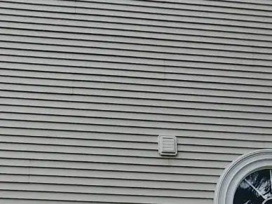 Close view of siding clean and white after soft washing